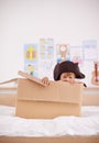 Home, portrait or costume as pirate to play in boat boxes or fantasy in bedroom or house. Kid hiding, child captain or Royalty Free Stock Photo