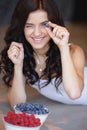 Home portrait of a happy woman with ripe berries Royalty Free Stock Photo