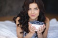 Home portrait of a happy woman with ripe berries Royalty Free Stock Photo