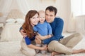 Home portrait of happy young family. Royalty Free Stock Photo