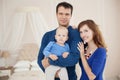 Home portrait of happy young family. Royalty Free Stock Photo