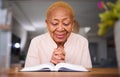 Home, prayer and old woman reading a bible, calm and peace with happiness, holy worship and support. Scripture, elderly Royalty Free Stock Photo