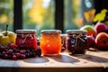 Home Preserves. 3 jars with delightful array of homemade jams strawberry, apricot, blackcurrant, raspberry, peach, or Royalty Free Stock Photo