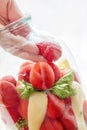 Home preserving of tomatoes. the hand settles the tomatoes in a jar for canning for the winter. Royalty Free Stock Photo