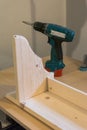 Production of handmade wooden pelmet, view with drill