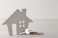Home purchase concept. Small decorative house and keys on a white background Royalty Free Stock Photo