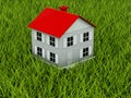 Home with red roof on grass