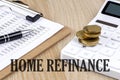 HOME REFINANCE text with chart and calculator and coins , business concept Royalty Free Stock Photo