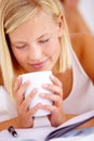 Home, relax and smelling with woman, coffee and notebook with weekend break, natural aroma and fresh. Morning, apartment