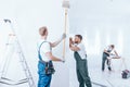 Home renovation crew finishing interior Royalty Free Stock Photo