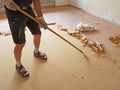 Home renovation living room. removing the old floor covering with a scraper Royalty Free Stock Photo