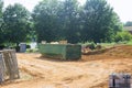 Home renovation maintenance a loaded dumpster near a construction Royalty Free Stock Photo