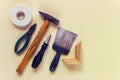 Home restoration and reparation tools on yellow background. Royalty Free Stock Photo