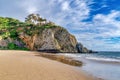 Home on rocky cliff bordering ocean at Laguna Beach California on a sunny day Royalty Free Stock Photo