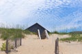 Home roof behind sand dunes 2