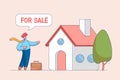 Home for sale concept. Selling house moving to new home, owner or realtor stands near the Sale Sign in front of the Royalty Free Stock Photo