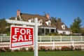 Home For Sale Real Estate Sign and House Royalty Free Stock Photo