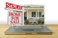 Home for Sale Sign on Laptop