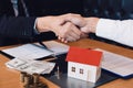 Home sales agents and buyers work on signing new homes and shaking hands Royalty Free Stock Photo