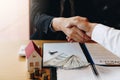 Home sales agents and buyers work on signing new homes and shaking hands Royalty Free Stock Photo