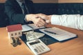 Home sales agents and buyers work on signing new homes and shaking hands Royalty Free Stock Photo