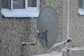 Home satellite dish on the wall of a panel apartment building in Royalty Free Stock Photo