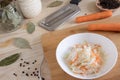 Home sauerkraut with carrots and spices on a plate, sauerkraut