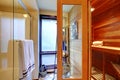 Home sauna interior with shower.