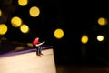 Home schooling, children reading book alone on quarantine or isolation time at night. Miniature tiny people toys photography with Royalty Free Stock Photo