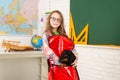 Home schooling. Funny little pupil wearing glasses. Pupil of primary school with puppy. Girl with gog in backpack near Royalty Free Stock Photo