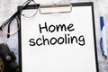 Home schooling word written on wood block. Home schooling text on table, concept Royalty Free Stock Photo