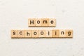 Home schooling word written on wood block. Home schooling text on table, concept Royalty Free Stock Photo