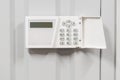 home security alarm on white wall security