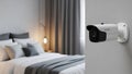 Home Security Camera Mounted on Wall in Modern Bedroom Royalty Free Stock Photo