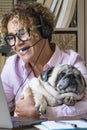 Home smart working people job business activity - cheerful young woman use zoom video call and laptop computer connection - Royalty Free Stock Photo