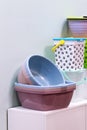 Home space organization, many different plastic household goods for storage and cleaning, selection of new clean washbowl,