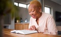 Home, spiritual and old woman reading a bible, faith and peace with religion, holy worship and calm. Scripture, elderly Royalty Free Stock Photo