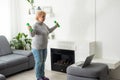 Home Sport. Active Senior Woman Doing Warming Stretching Exercises In Front Of Laptop, Training With Online Tutorials Royalty Free Stock Photo
