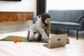 Arab woman doing gymnastics in the bedroom. She's at home. Royalty Free Stock Photo