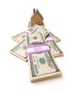 Home and Stacks of Money Isolated Royalty Free Stock Photo