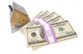 Home and Stacks of Money Isolated Royalty Free Stock Photo