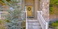 Home with stairs leading to porch and front door Royalty Free Stock Photo