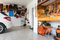 Home suburban car garage interior with wooden shelf, tools equipment stuff storage warehouse on white wall indoor