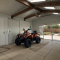 Home suburban countryside modern car and ATV double garage interior with wooden shelf, tools and equipment stuff storage warehouse