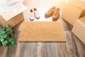 Home Sweet Home Welcome Mat, Moving Boxes, Women and Male Shoes Royalty Free Stock Photo