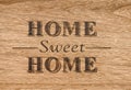 Home sweet home sign on a wood background Royalty Free Stock Photo