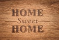 Home sweet home sign on a wood background Royalty Free Stock Photo