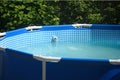 Home swimming pool with filtration system for clean water Royalty Free Stock Photo