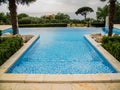 Home swimming pool in garden and villa terrace - summer holidays and luxury lifestyle concept Royalty Free Stock Photo