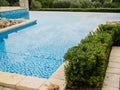 Home swimming pool in garden and villa terrace - summer holidays and luxury lifestyle concept Royalty Free Stock Photo